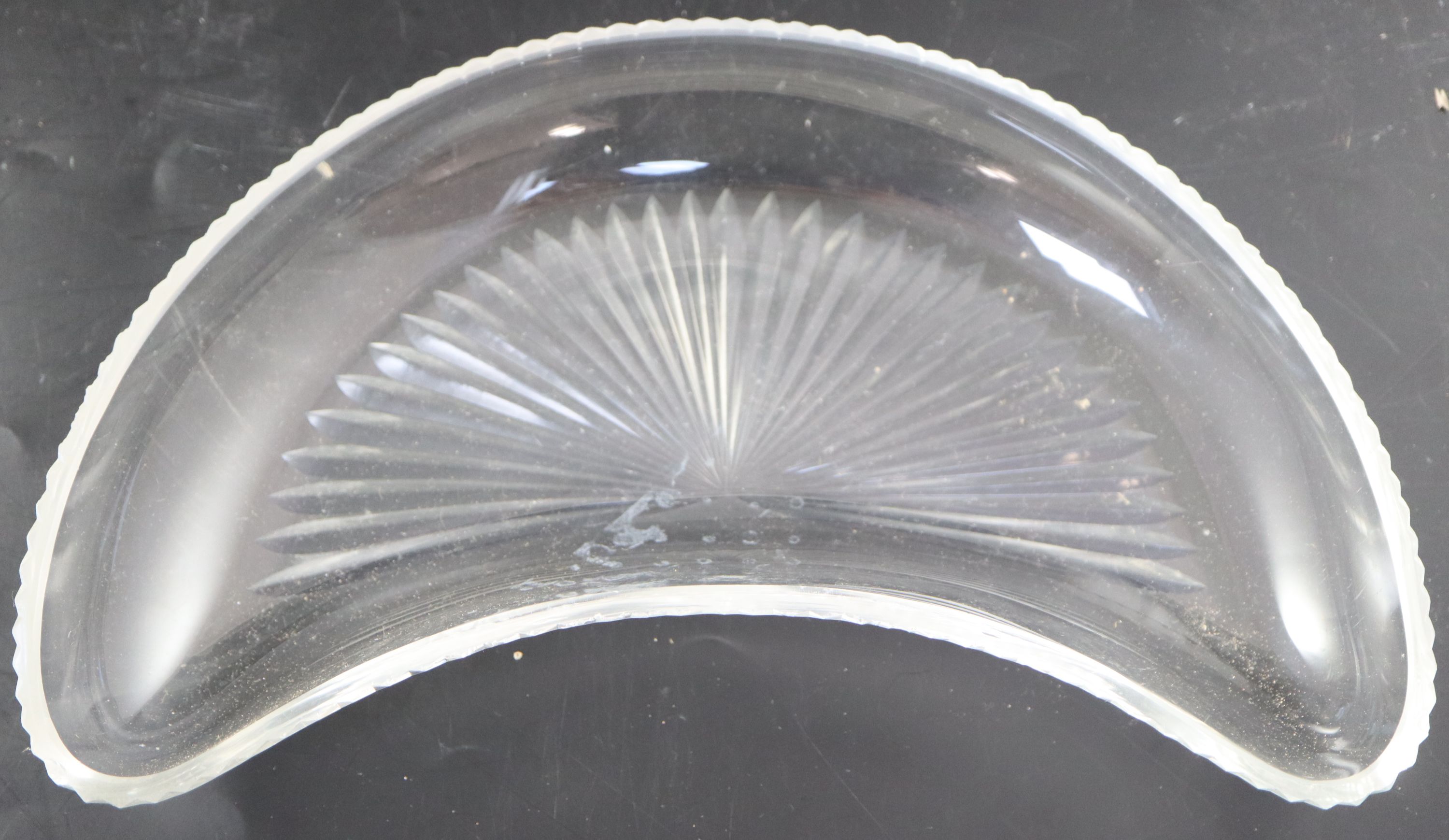 A set of twelve cut glass crescent shaped hors doeuvres dishes,